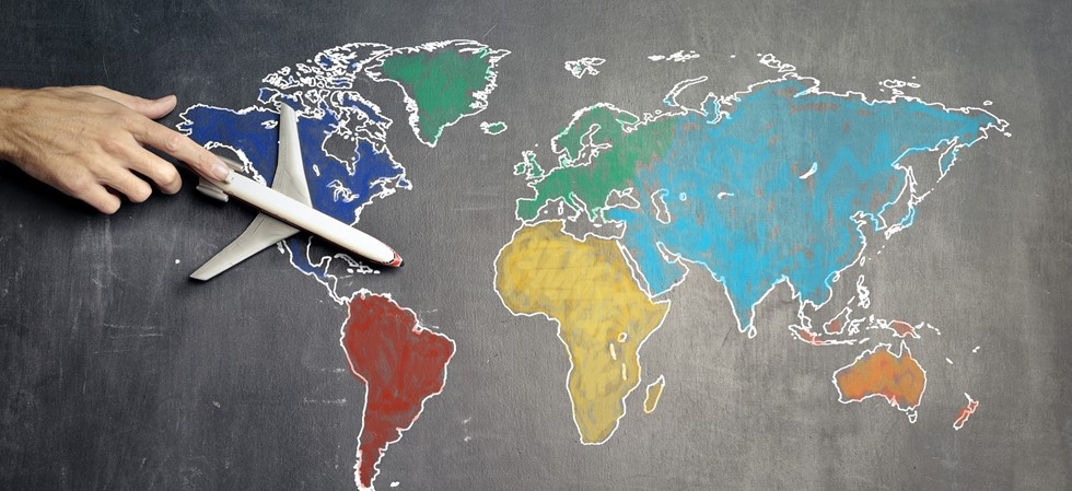 map of the world in chalk with a plane